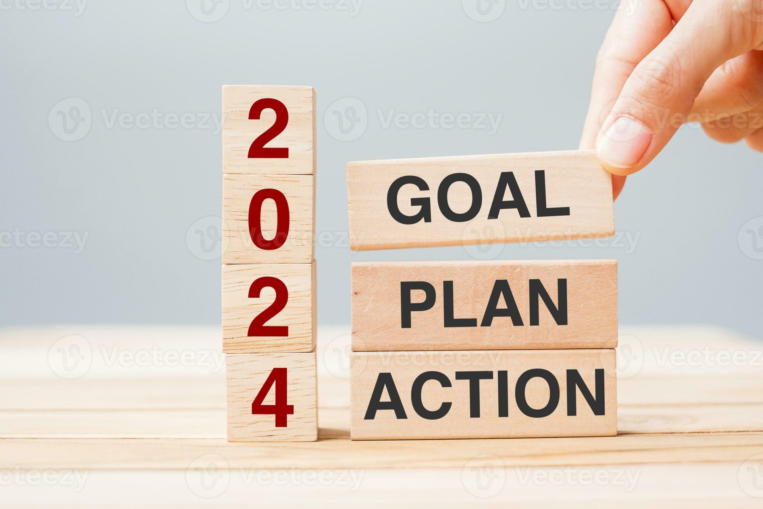 Hand Holding Wooden Block With Text 2024 Goal Plan And Action On Table Background Resolution Strategy Solution Goal Business And New Year Holiday Concepts Photo Scaled 